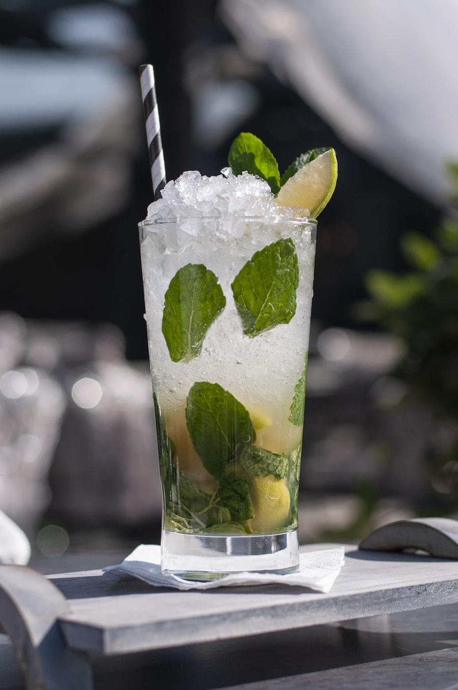 Fresh mojito being poured and garnished